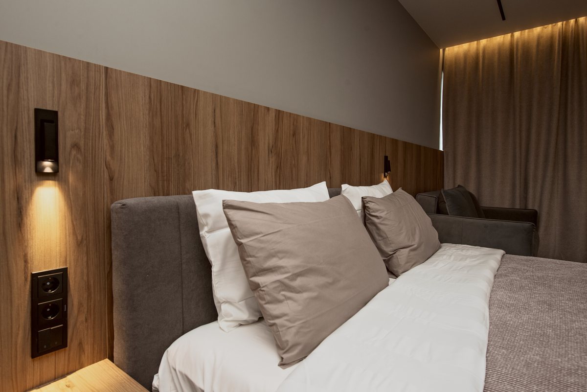 King bed with reading lights and blackout curtains
